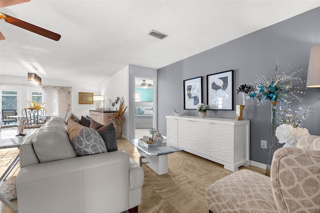 4168 Harbor Blvd, Port Charlotte, FL 33952 - living room with visible vents, a ceiling fan, and baseboards