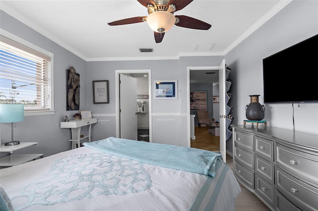 4168 Harbor Blvd, Port Charlotte, FL 33952 - bedroom featuring wood finished floors, visible vents, crown molding, and ceiling fan