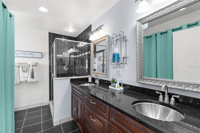 4168 Harbor Blvd, Port Charlotte, FL 33952 - bathroom featuring double vanity, tile patterned floors, a stall shower, and a sink