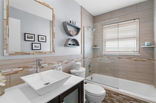 4168 Harbor Blvd, Port Charlotte, FL 33952 - full bath with tiled shower / bath, toilet, vanity, and tile walls