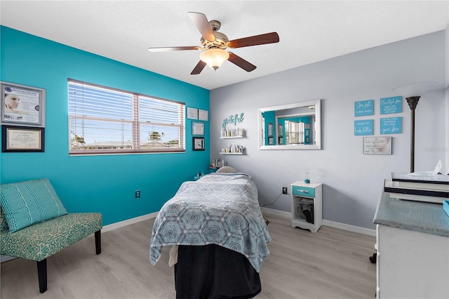 4168 Harbor Blvd, Port Charlotte, FL 33952 - bedroom with light wood-type flooring, a ceiling fan, and baseboards