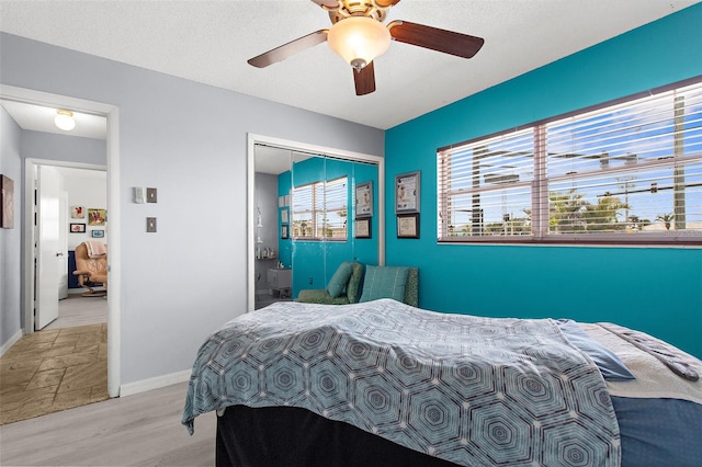 4168 Harbor Blvd, Port Charlotte, FL 33952 - bedroom with wood finished floors, a closet, a ceiling fan, and baseboards