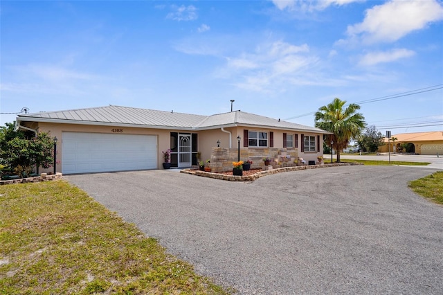4168 Harbor Blvd, Port Charlotte, FL 33952 - ranch-style home with a garage, driveway, and stucco siding
