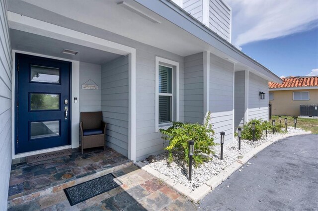 280 Belvedere Ct, Punta Gorda, FL 33950 - doorway to property with central AC unit