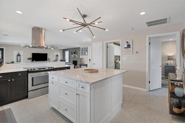 280 Belvedere Ct, Punta Gorda, FL 33950 - kitchen with a center island, visible vents, light speckled floor, stainless steel range with electric cooktop, and island range hood