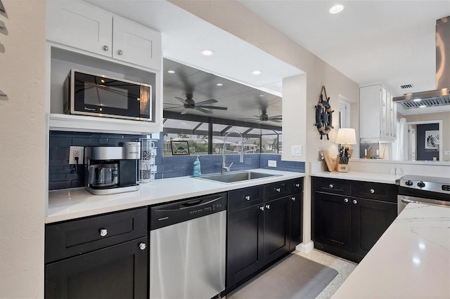 280 Belvedere Ct, Punta Gorda, FL 33950 - kitchen featuring stainless steel appliances, recessed lighting, light countertops, and dark cabinetry