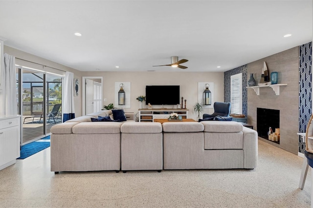 280 Belvedere Ct, Punta Gorda, FL 33950 - living area with a large fireplace, speckled floor, a ceiling fan, and recessed lighting