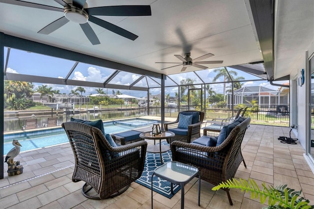 280 Belvedere Ct, Punta Gorda, FL 33950 - view of patio featuring a lanai, ceiling fan, a hot tub, and a water view