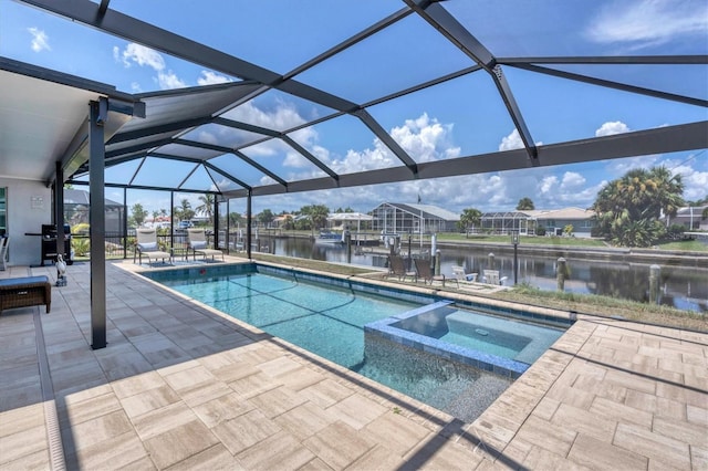 280 Belvedere Ct, Punta Gorda, FL 33950 - view of swimming pool with a water view, glass enclosure, a patio, and a pool with connected hot tub