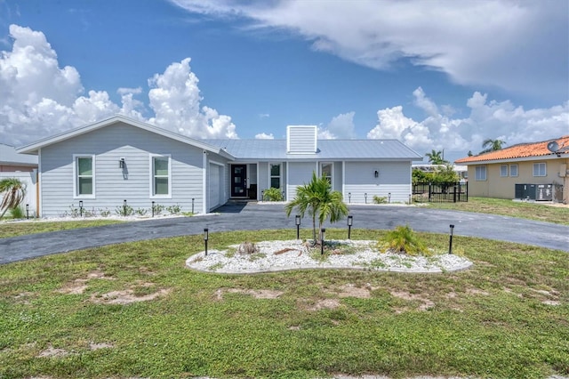 280 Belvedere Ct, Punta Gorda, FL 33950 - ranch-style home with an attached garage, aphalt driveway, and a front lawn