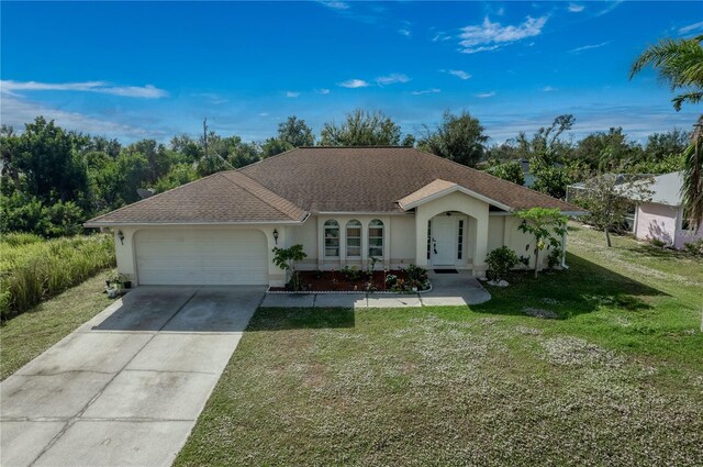 ranch-style home with driveway, an attached garage, a front lawn, roof with shingles, and stucco siding