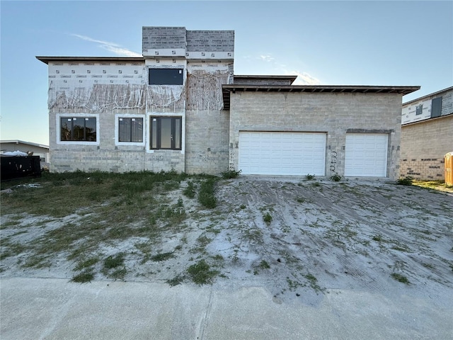 242 Bangsberg Rd SE, Port Charlotte, FL 33952 - view of side of home with driveway and a garage