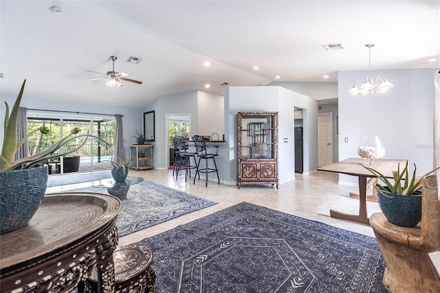 2661 30th Ave SE, Naples, FL 34117 - living room featuring ceiling fan with notable chandelier, lofted ceiling, and visible vents