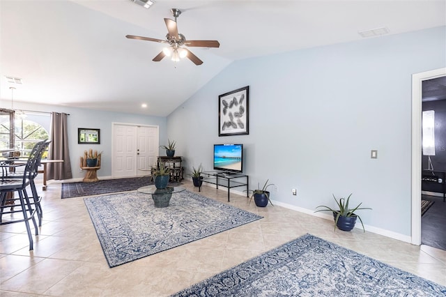 2661 30th Ave SE, Naples, FL 34117 - living room with visible vents, baseboards, a ceiling fan, vaulted ceiling, and tile patterned flooring