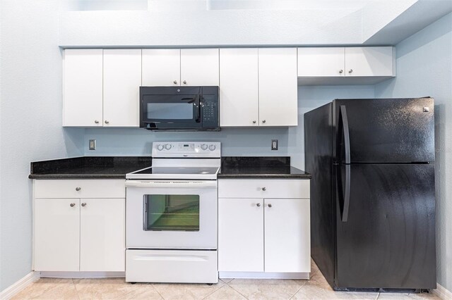 2661 30th Ave SE, Naples, FL 34117 - kitchen with white cabinets, baseboards, and black appliances