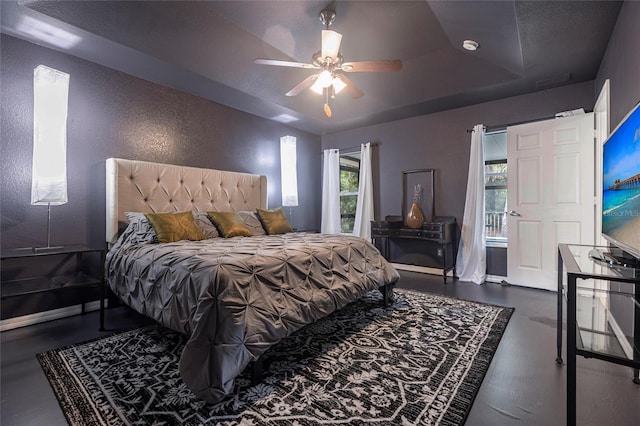 2661 30th Ave SE, Naples, FL 34117 - bedroom with a textured wall, baseboards, a ceiling fan, and a raised ceiling