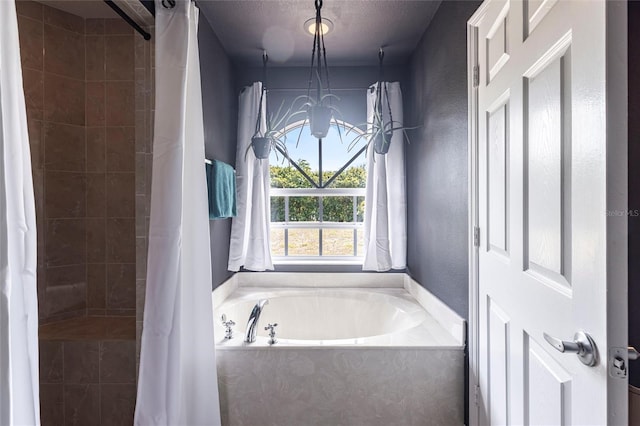2661 30th Ave SE, Naples, FL 34117 - bathroom with a bath, an inviting chandelier, a textured wall, a textured ceiling, and tiled shower