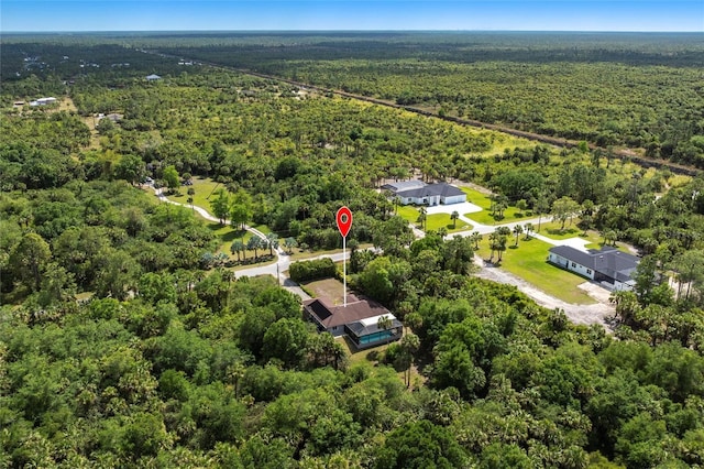 2661 30th Ave SE, Naples, FL 34117 - birds eye view of property with a wooded view