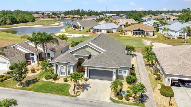 birds eye view of property with a residential view and a water view