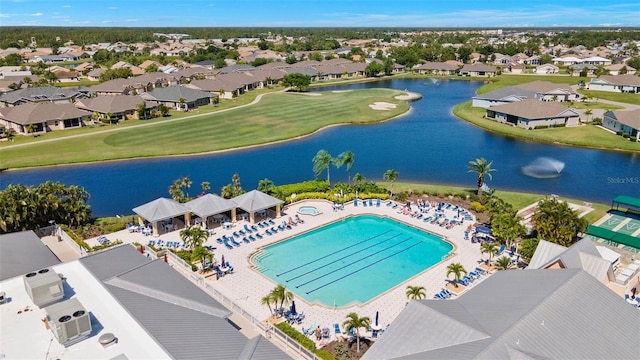 drone / aerial view with a water view and a residential view