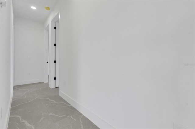 3217 23rd St SW, Lehigh Acres, FL 33976 - hallway featuring marble finish floor, baseboards, and recessed lighting