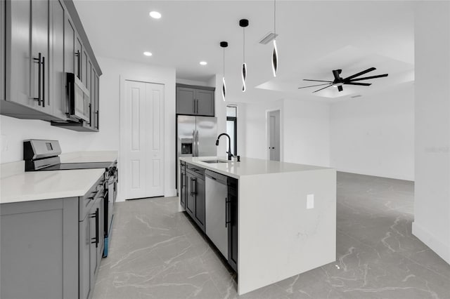 3217 23rd St SW, Lehigh Acres, FL 33976 - kitchen with recessed lighting, marble finish floor, a sink, a ceiling fan, and appliances with stainless steel finishes