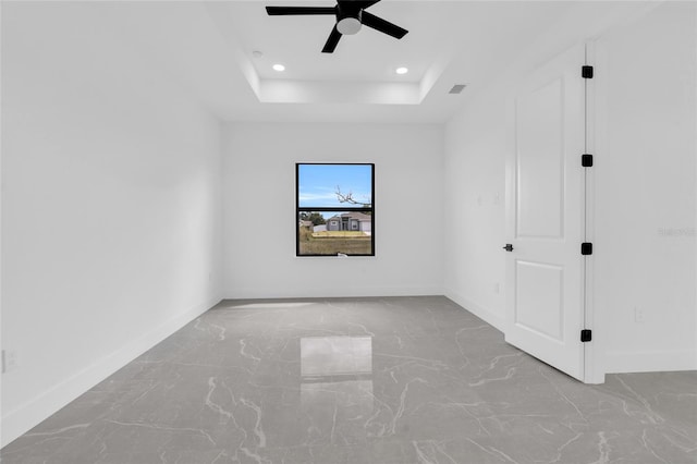 3217 23rd St SW, Lehigh Acres, FL 33976 - unfurnished room featuring a ceiling fan, a raised ceiling, baseboards, and recessed lighting