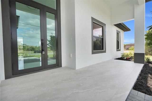 3217 23rd St SW, Lehigh Acres, FL 33976 - view of patio / terrace featuring french doors