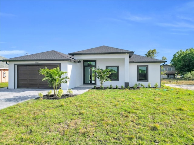 3217 23rd St SW, Lehigh Acres, FL 33976 - prairie-style home with a front yard, driveway, stucco siding, and an attached garage