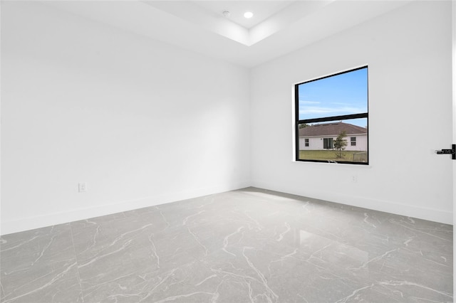 3217 23rd St SW, Lehigh Acres, FL 33976 - unfurnished room featuring a raised ceiling, baseboards, and recessed lighting
