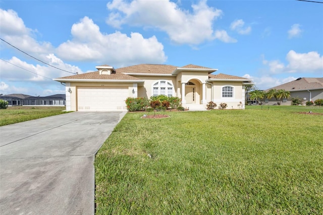 235 Tournament Rd, Rotonda West, FL 33947 - mediterranean / spanish-style home featuring an attached garage, concrete driveway, stucco siding, and a front lawn