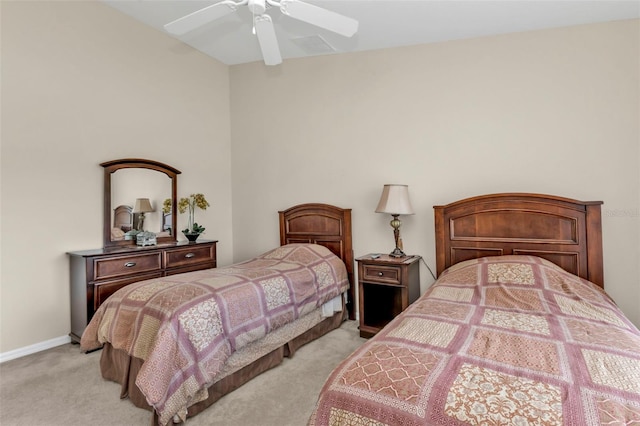 235 Tournament Rd, Rotonda West, FL 33947 - bedroom with baseboards, light colored carpet, and a ceiling fan