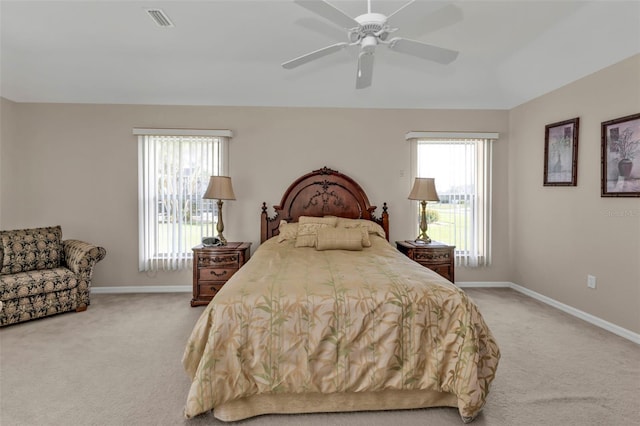 235 Tournament Rd, Rotonda West, FL 33947 - bedroom featuring visible vents, baseboards, ceiling fan, and light colored carpet