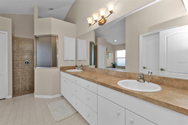 235 Tournament Rd, Rotonda West, FL 33947 - bathroom with a sink, tile patterned floors, walk in shower, and double vanity