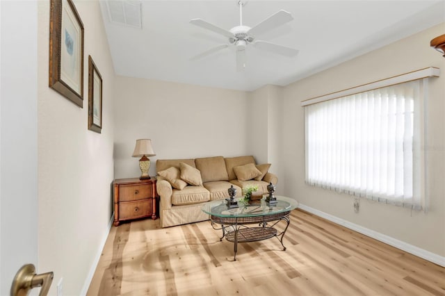 235 Tournament Rd, Rotonda West, FL 33947 - living area featuring visible vents, baseboards, ceiling fan, and wood finished floors