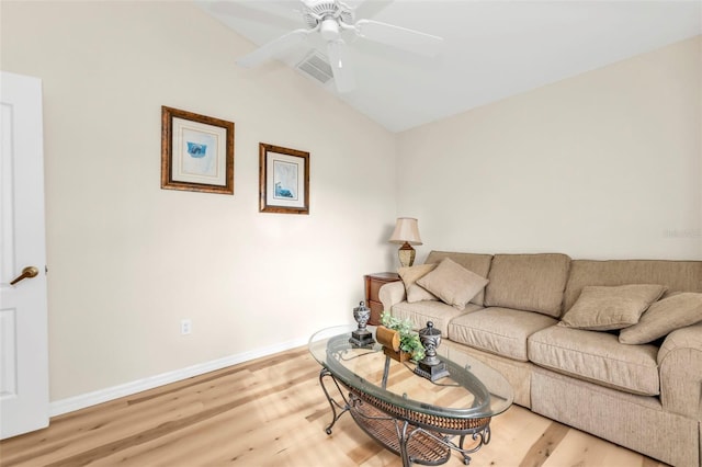 235 Tournament Rd, Rotonda West, FL 33947 - living area with baseboards, vaulted ceiling, a ceiling fan, visible vents, and light wood finished floors