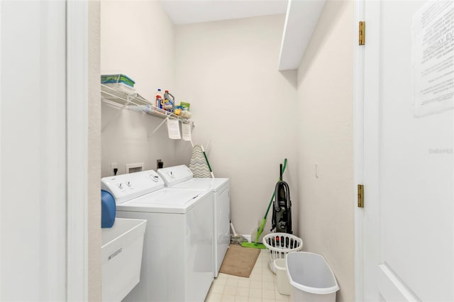 235 Tournament Rd, Rotonda West, FL 33947 - laundry area with separate washer and dryer, laundry area, a sink, and light floors