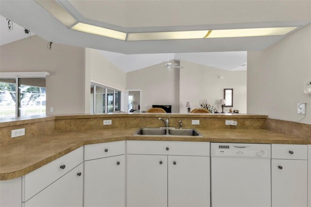 235 Tournament Rd, Rotonda West, FL 33947 - kitchen featuring a sink, white cabinets, white dishwasher, and lofted ceiling