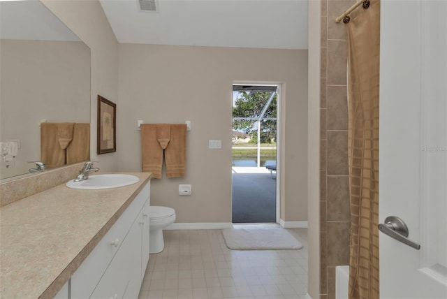 235 Tournament Rd, Rotonda West, FL 33947 - full bathroom featuring visible vents, baseboards, toilet, vanity, and tile patterned flooring