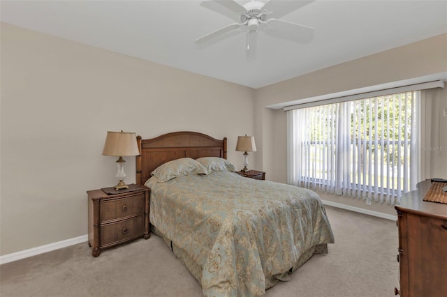 235 Tournament Rd, Rotonda West, FL 33947 - bedroom featuring baseboards, a ceiling fan, and light colored carpet