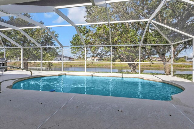 235 Tournament Rd, Rotonda West, FL 33947 - outdoor pool with a patio area, a water view, and a lanai