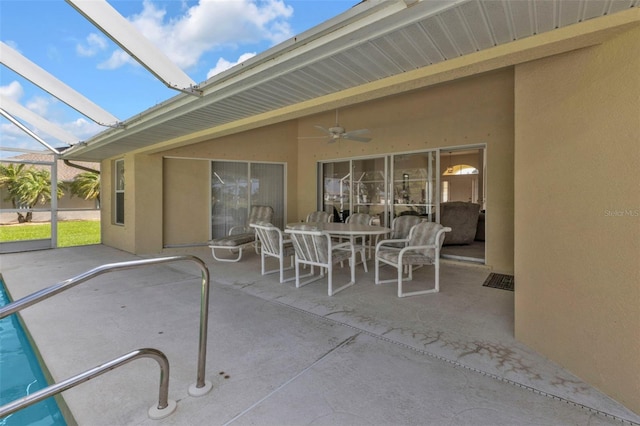 235 Tournament Rd, Rotonda West, FL 33947 - view of patio / terrace featuring outdoor dining area, a ceiling fan, and glass enclosure