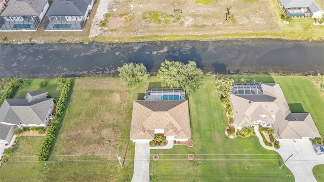 235 Tournament Rd, Rotonda West, FL 33947 - drone / aerial view featuring a water view and a residential view