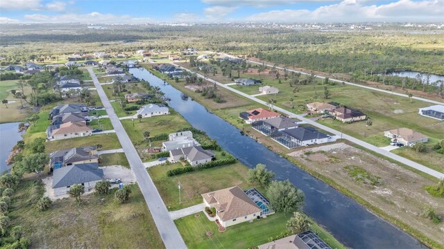 235 Tournament Rd, Rotonda West, FL 33947 - birds eye view of property with a water view and a residential view