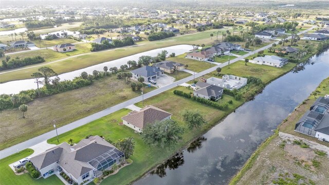 235 Tournament Rd, Rotonda West, FL 33947 - birds eye view of property with a water view and a residential view