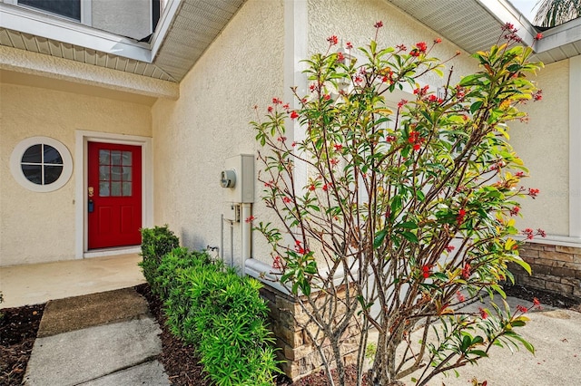 1156 Jonah Dr, North Port, FL 34289 - entrance to property with stucco siding