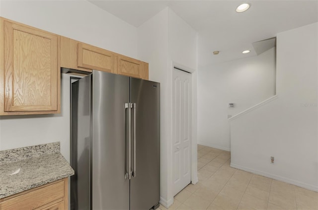 1156 Jonah Dr, North Port, FL 34289 - kitchen with recessed lighting, light brown cabinetry, baseboards, light stone countertops, and high quality fridge