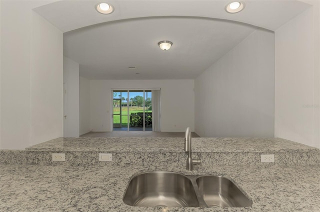 1156 Jonah Dr, North Port, FL 34289 - kitchen featuring recessed lighting, light stone countertops, and a sink