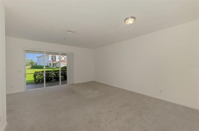 1156 Jonah Dr, North Port, FL 34289 - spare room featuring light colored carpet and visible vents