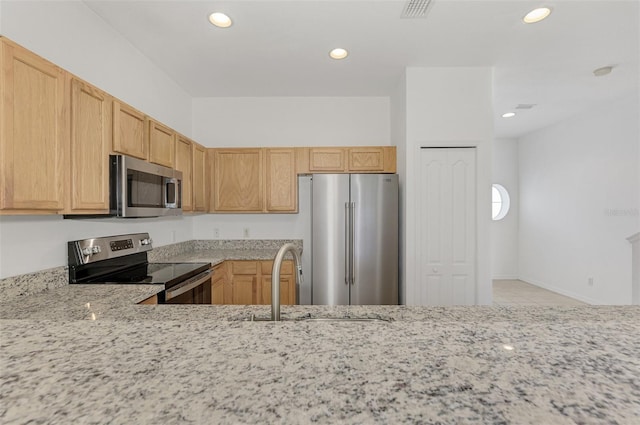 1156 Jonah Dr, North Port, FL 34289 - kitchen featuring visible vents, stainless steel appliances, recessed lighting, a sink, and light stone counters